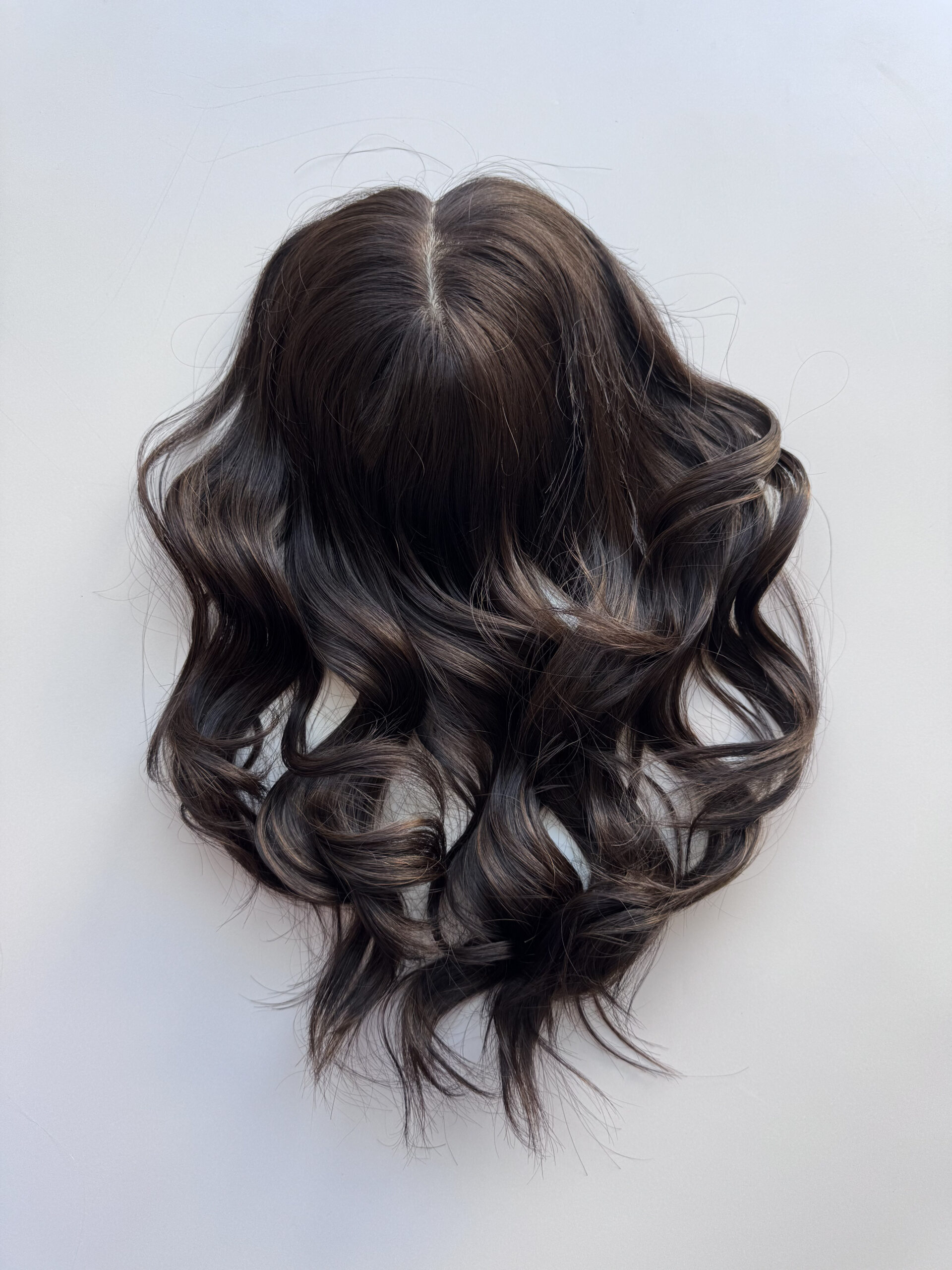 Darkhair topper made from natural Brazilian hair. A solution for hair loss, thinning hair, or fine hair.