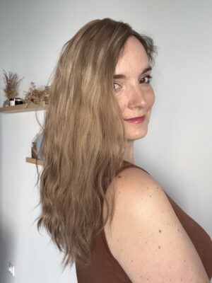 Thehair  topper  is made of natural hair. It is a golden blonde shade accented with subtle light blonde highlights.